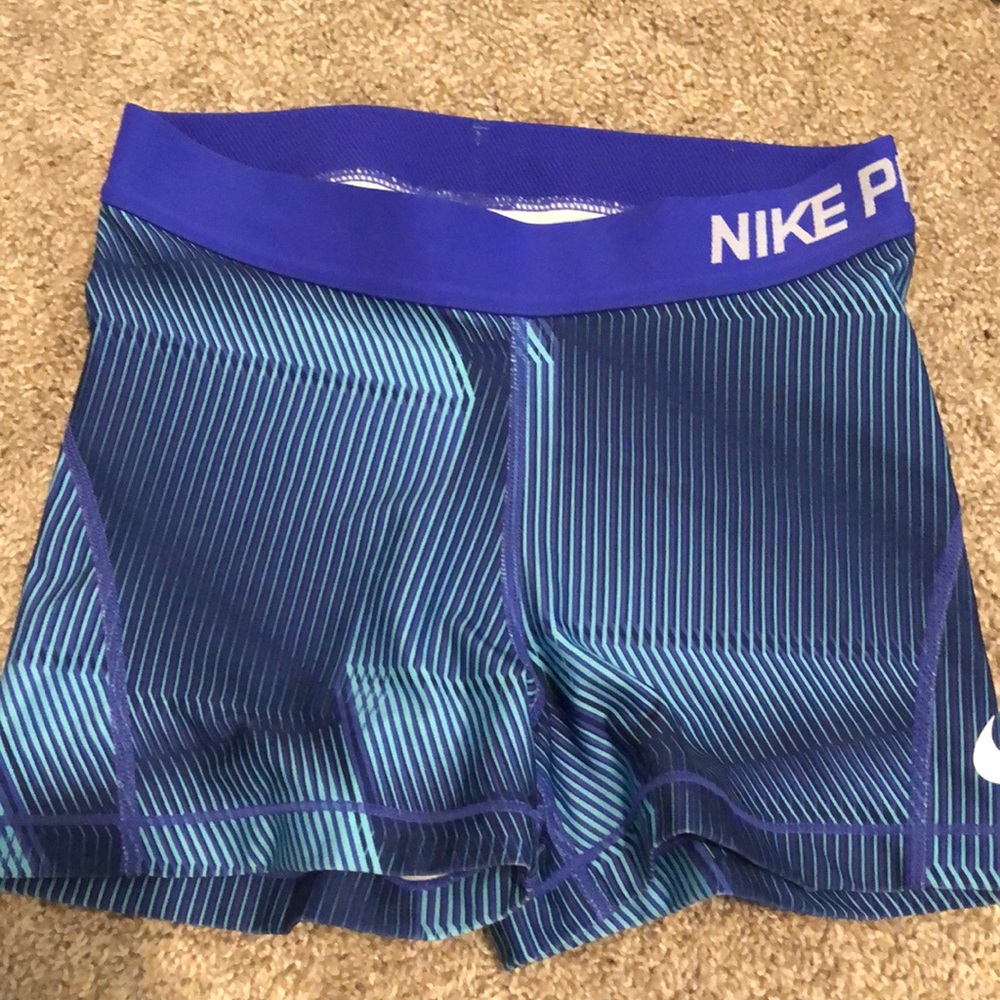 blue patterned nike pros